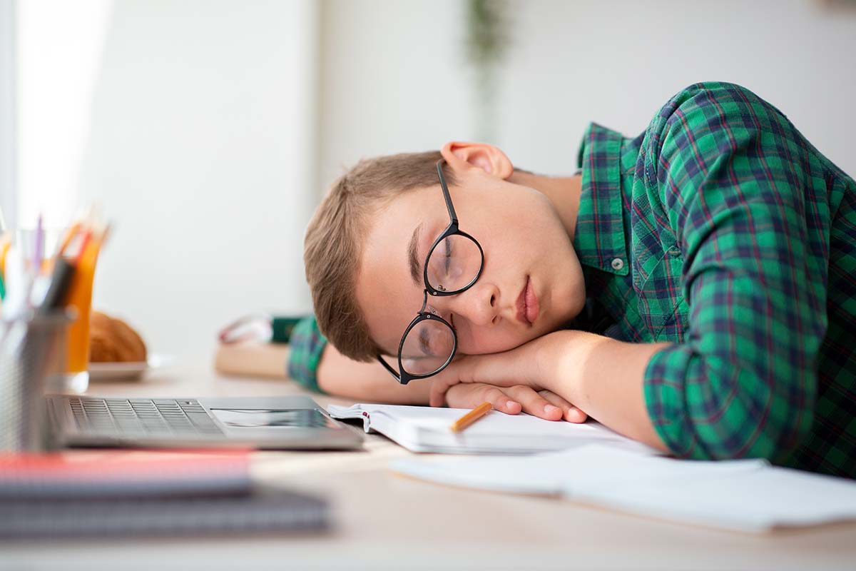 Long-Term Consequences of Heavy Marijuana Use a boy falls asleep in school from heavy marijuana use
