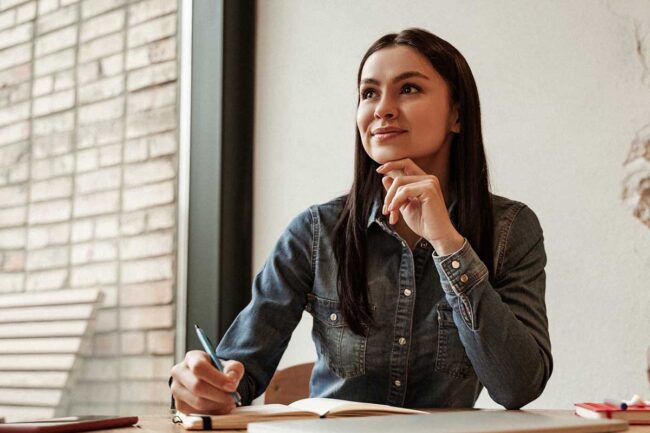 How Do You Prepare for Alcohol Detox a woman sitting taking notes thinks about how to prepare for alcohol detox