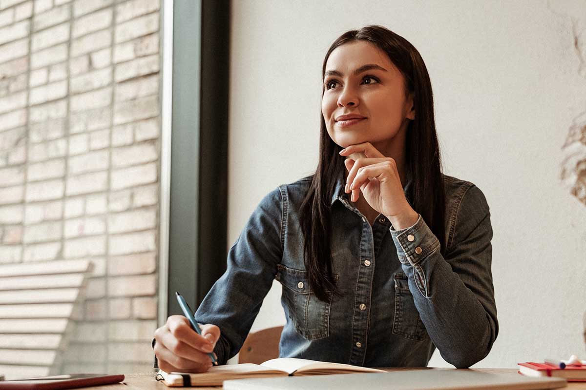 How Do You Prepare for Alcohol Detox a woman sitting taking notes thinks about how to prepare for alcohol detox