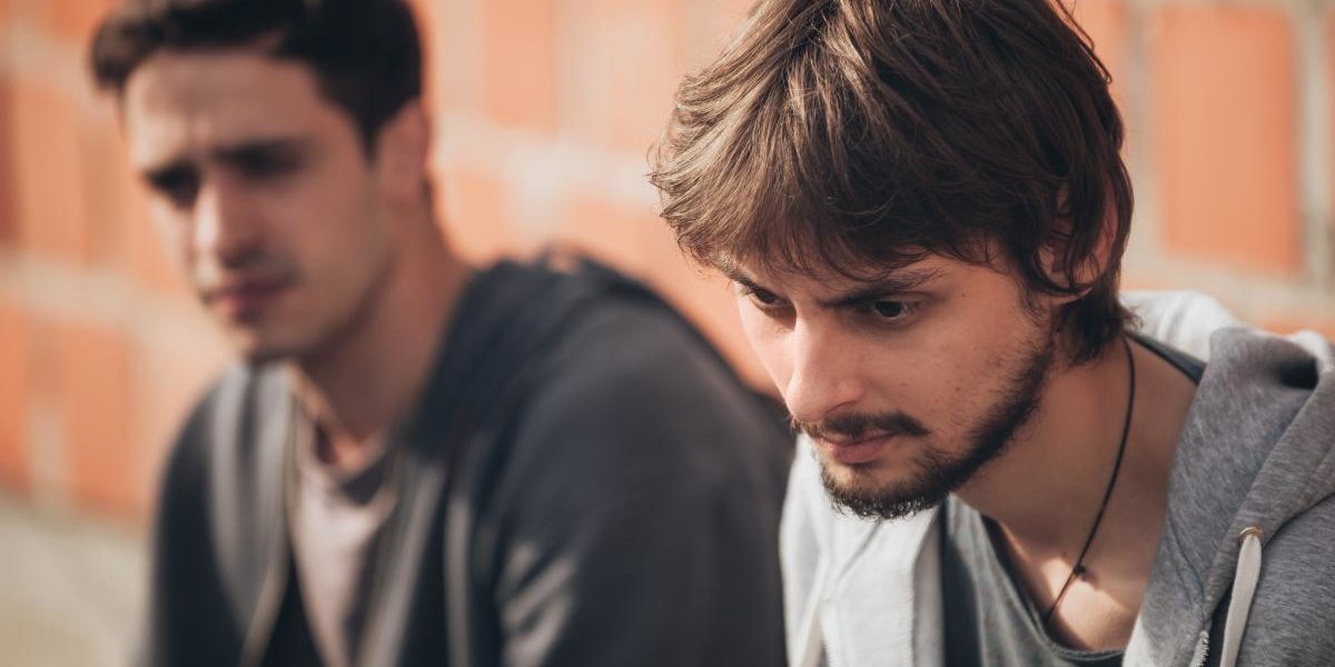 two men discuss signs of cocaine addiction in a loved one
