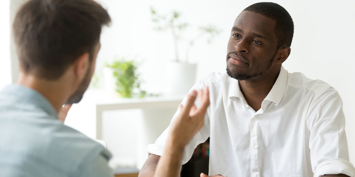 two men discuss inpatient addiction treatment in spokane wa