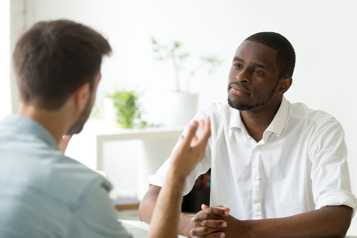 two men discuss inpatient addiction treatment in spokane wa