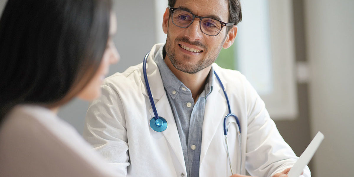 Is a Partial Hospitalization Program for Me a woman sitting with her doctor and asking him when is a partial hospitalization program for me