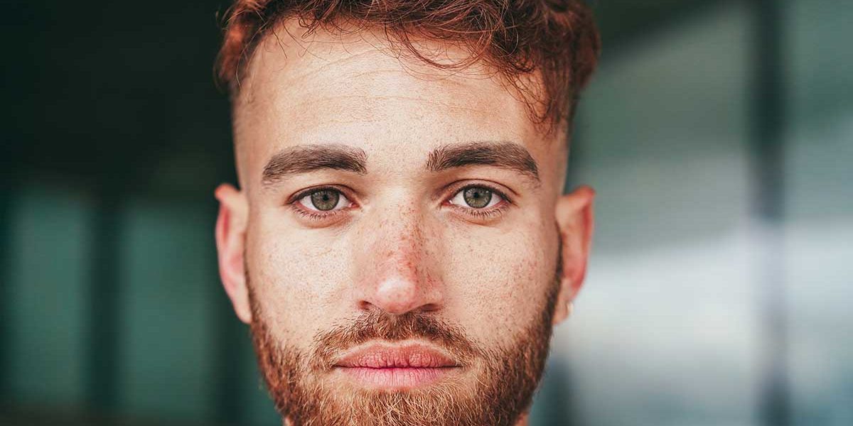 4 Stages of Overcoming a Meth Addiction a man with a beard looks forward and thinks about how thankful he is for overcoming his meth addiction