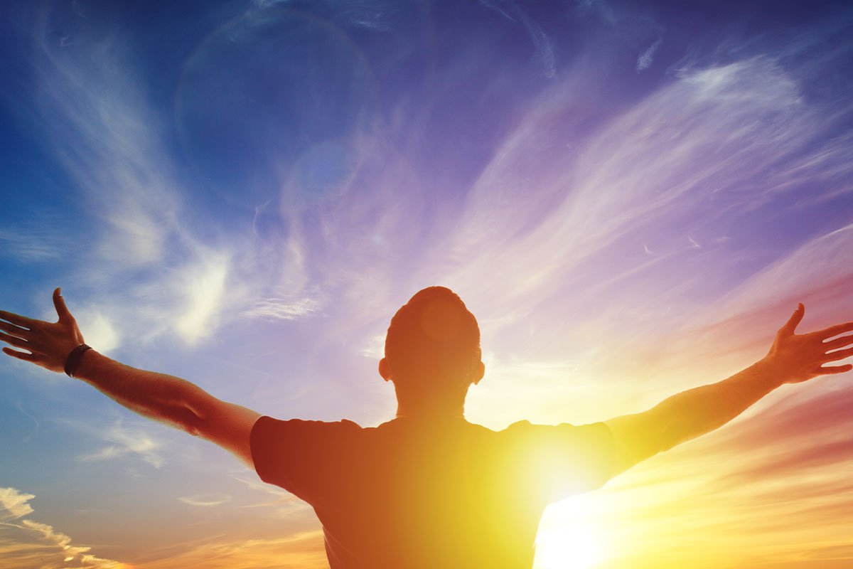 5 Steps to Overcome Meth Addiction a man is open armed toward the sunrise sky and feeling enlightened by learning how to overcome meth addiction