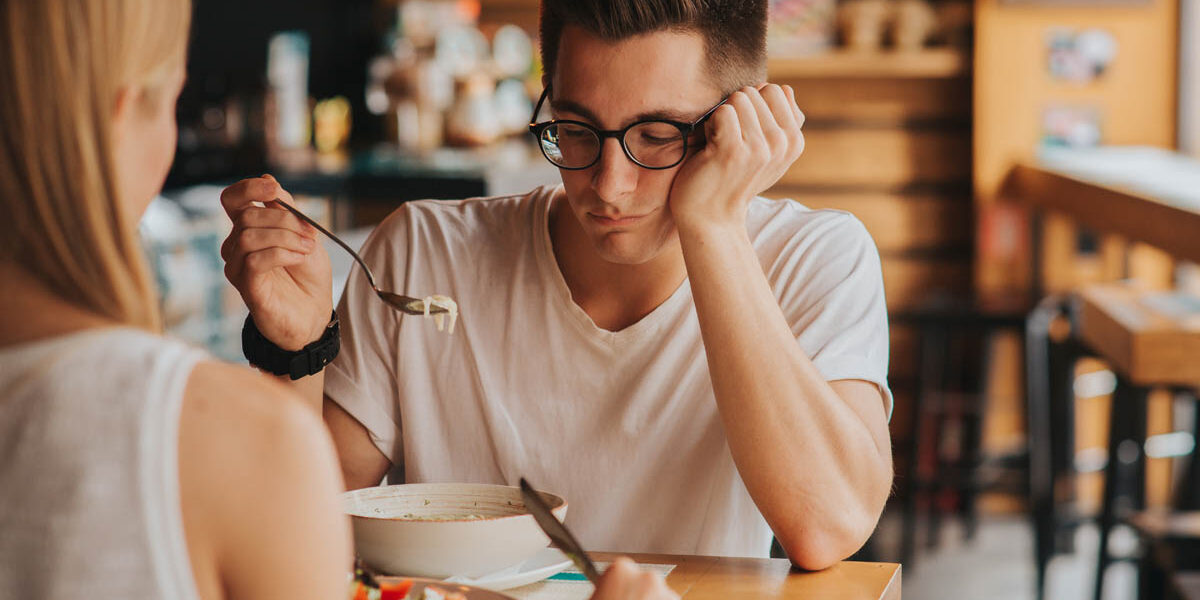 Does Alcohol Suppress Appetite The Danger Behind It a person is out to lunch and struggles with eating their lunch and asks their friend does alcohol suppress appetite