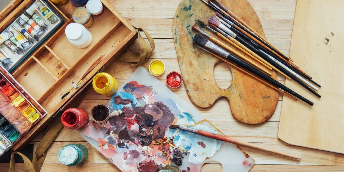 10 Art Therapy Activities a photo of a bunch of painting supplies as part of learning about art therapy activities