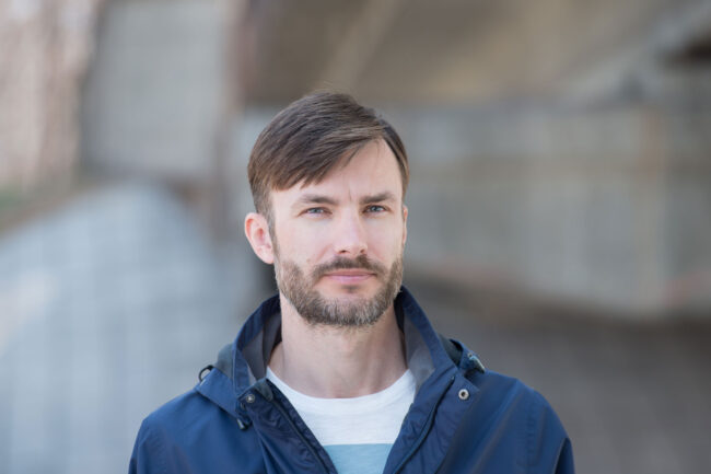 Am I ready for rehab a man in a jacket is outside and wondering if he should go to rehab