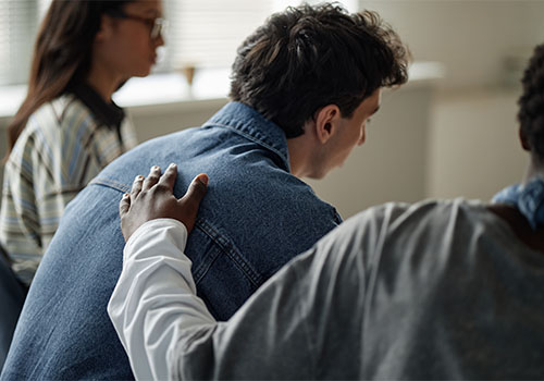 Drug and Alcohol Rehab Image Comforting someone in group therapy
