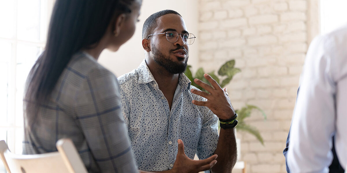 Man speaking in group therapy