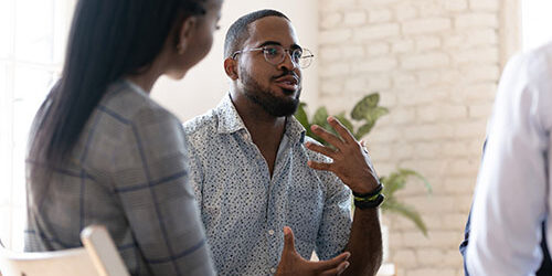 Man talking during group therapy