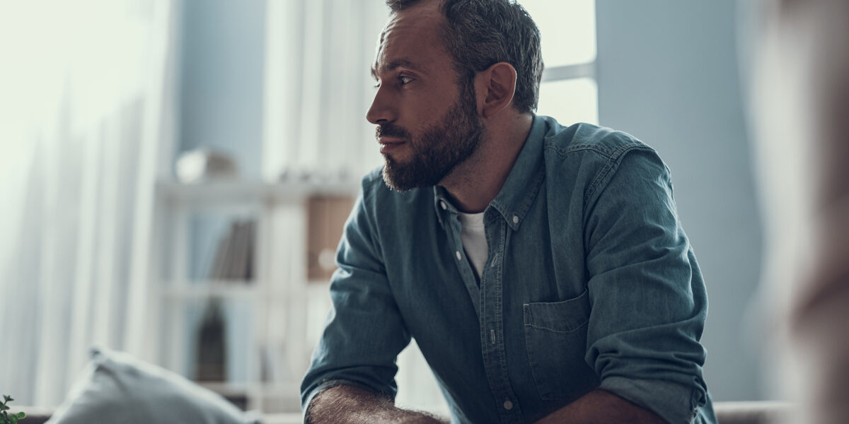 Depressed man looking away