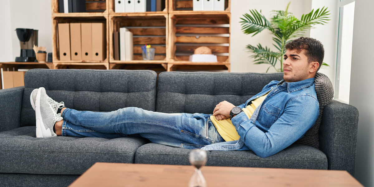 Man sitting on couch in counselor's office