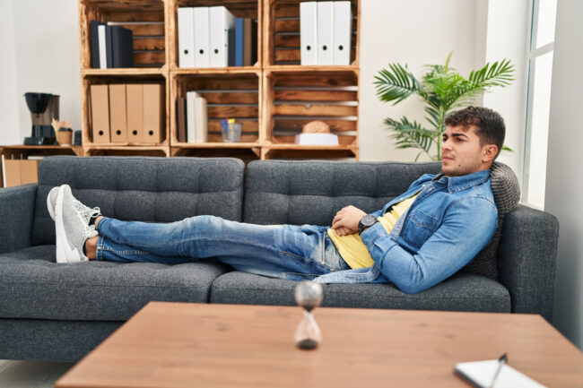 Man sitting on couch in counselor's office