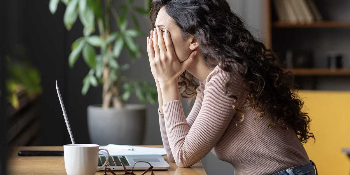 woman feeling tired while working